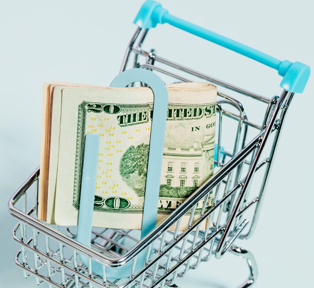 Shopping cart with a wad of bills inside